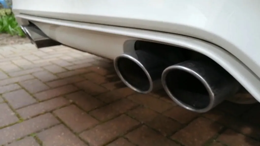 Dual exhaust tips on a performance car, highlighting an aftermarket exhaust upgrade