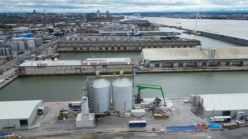 Aerial view of Liverpool Port showing industrial buildings, storage tanks, and dock facilities along the waterfront in one of the key UK towns