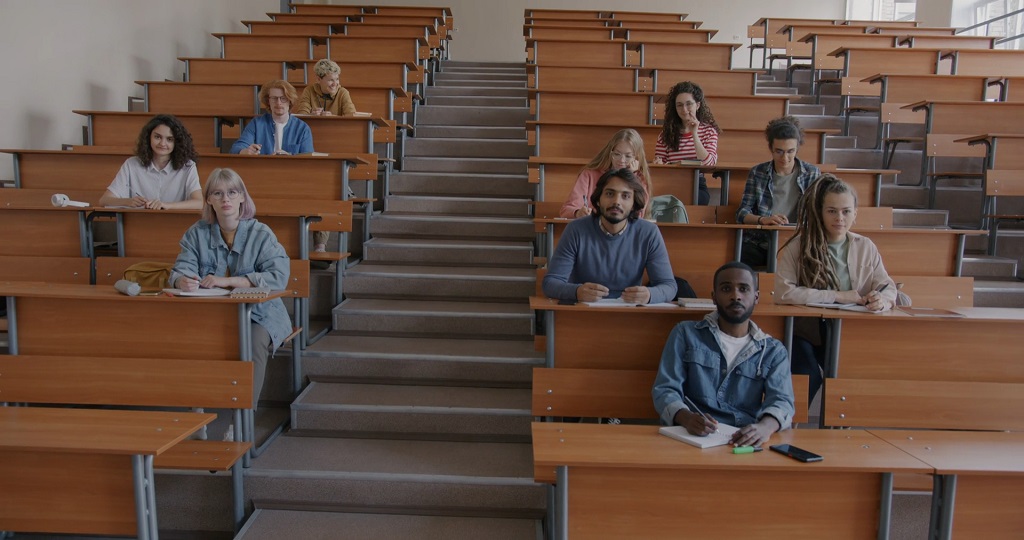 College students in a university lecture hall, a common setting in Education Rankings by Country metrics