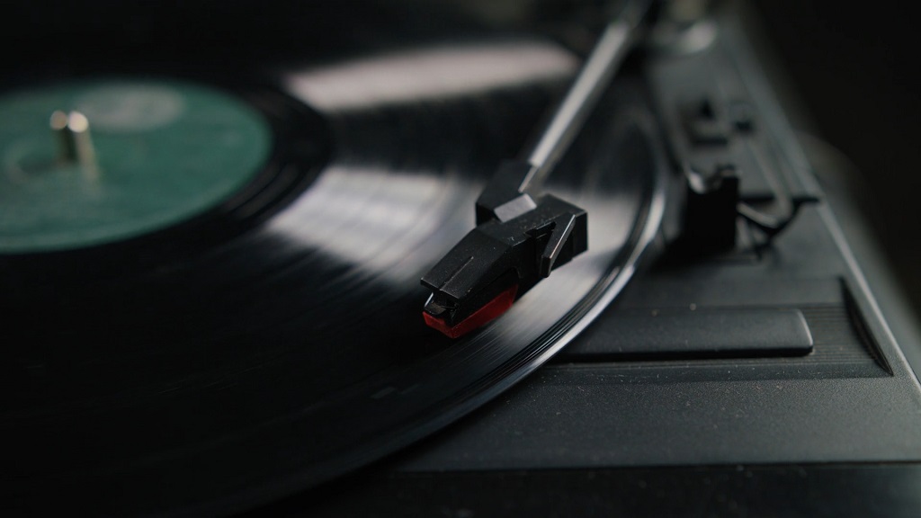 Close-up of a record player spinning vinyl, perfect backdrop for music-based games for adults