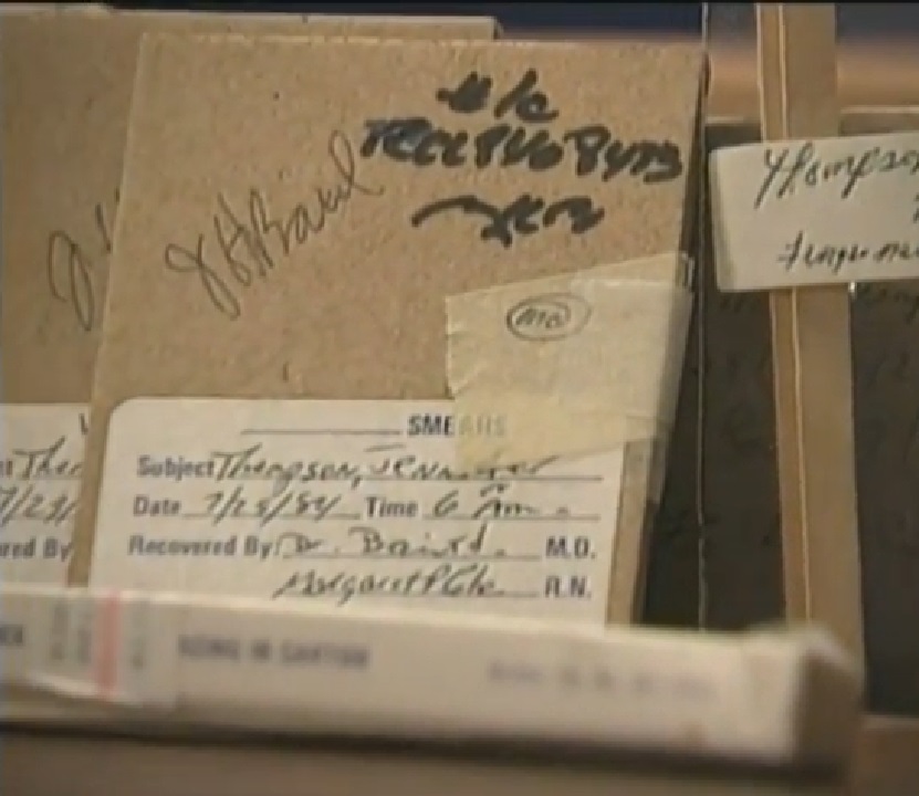 Close-up of old forensic evidence files, including handwritten labels and documentation from the 1984 Ronald Cotton case