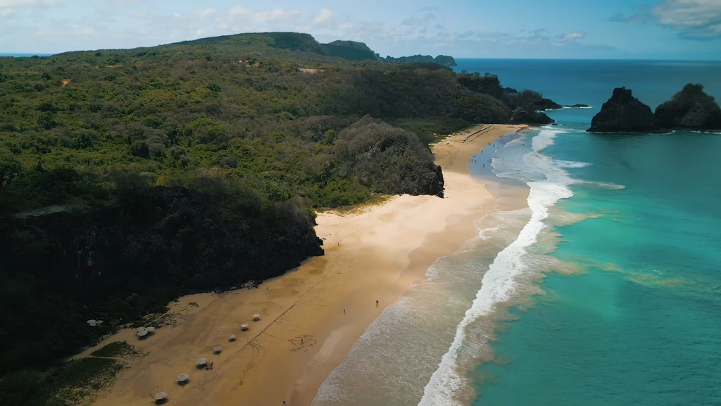 Aerial view of Praia do Bode with turquoise waters and lush cliffs in Fernando de Noronha