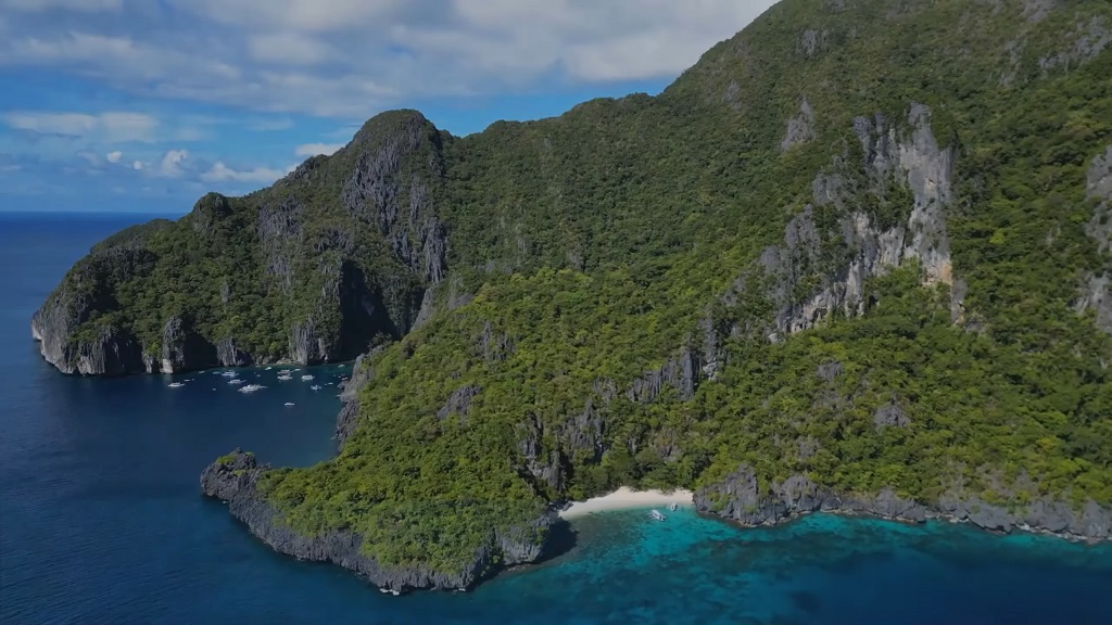Aerial view of dramatic cliffs and emerald waters near Fernando de Noronha