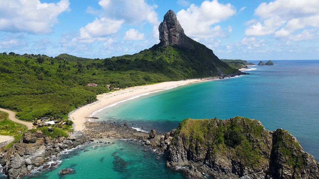Aerial view of Praia da Conceição and iconic Morro do Pico in Fernando de Noronha