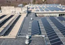 Image of solar panels on a warehouse showing the full potential of the latest rooftop solar project.