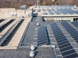 Image of solar panels on a warehouse showing the full potential of the latest rooftop solar project.