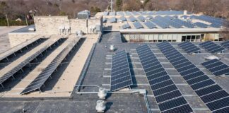 Image of solar panels on a warehouse showing the full potential of the latest rooftop solar project.