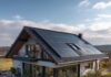 An image of a house with a rooftop covered with solar panels.