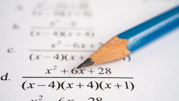 12 Essential Geometry and Algebra Topics Students Must Master Before Final Exams Student works through geometry and algebra topics on paper with a pencil and visible equations