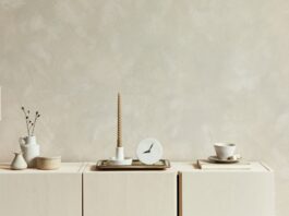 Neutral wall decor shows soft interior paint colors in a calm cream-toned room