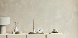 Neutral wall decor shows soft interior paint colors in a calm cream-toned room