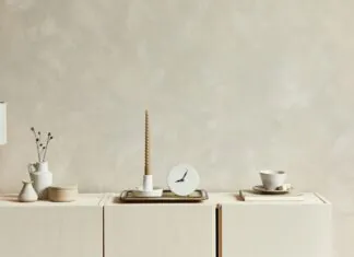 Neutral wall decor shows soft interior paint colors in a calm cream-toned room