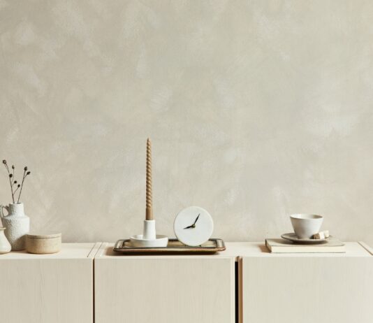 Neutral wall decor shows soft interior paint colors in a calm cream-toned room